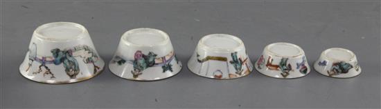 A set of nine Chinese famille rose nesting cups, Daoguang period, graduating from 4.1cm to 11cm, largest cup with rim chip and short ha